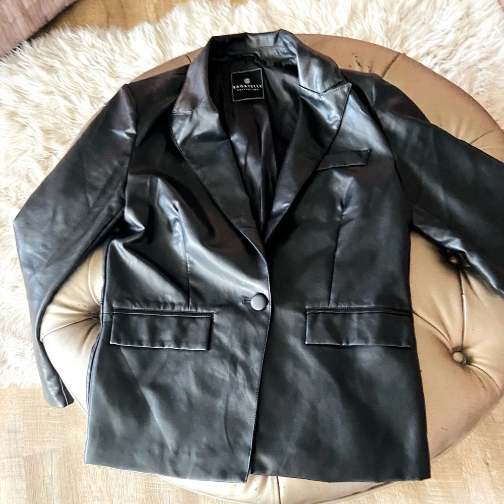 Black leather blazer w/black leather skirt.